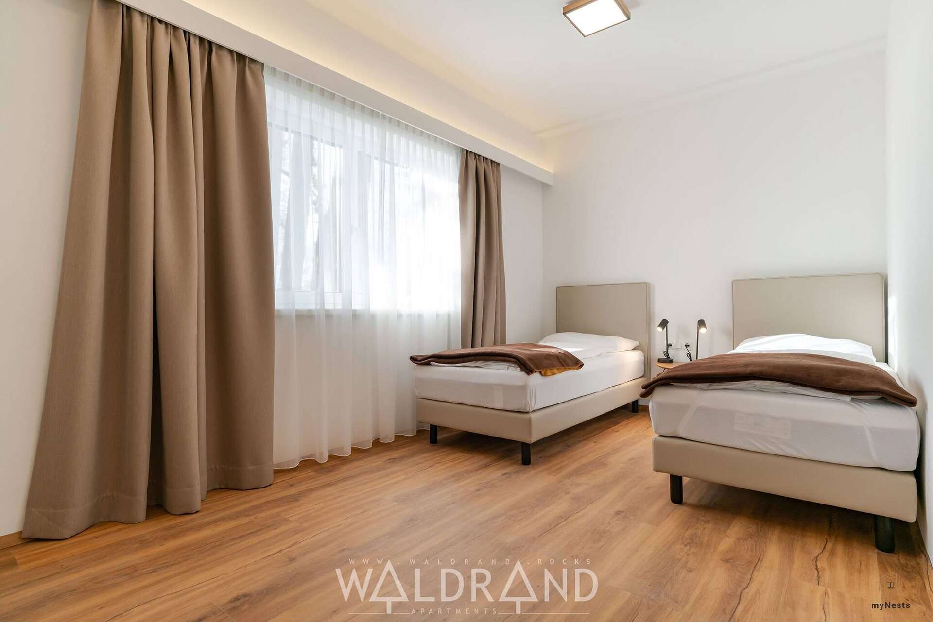 Schlafzimmer mit zwei Einzelbetten im Apartment Spiegelmeise 2